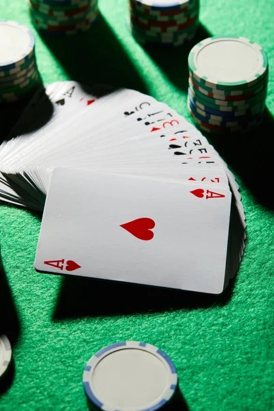 Multi-camera live studio broadcast showing dealers and table action